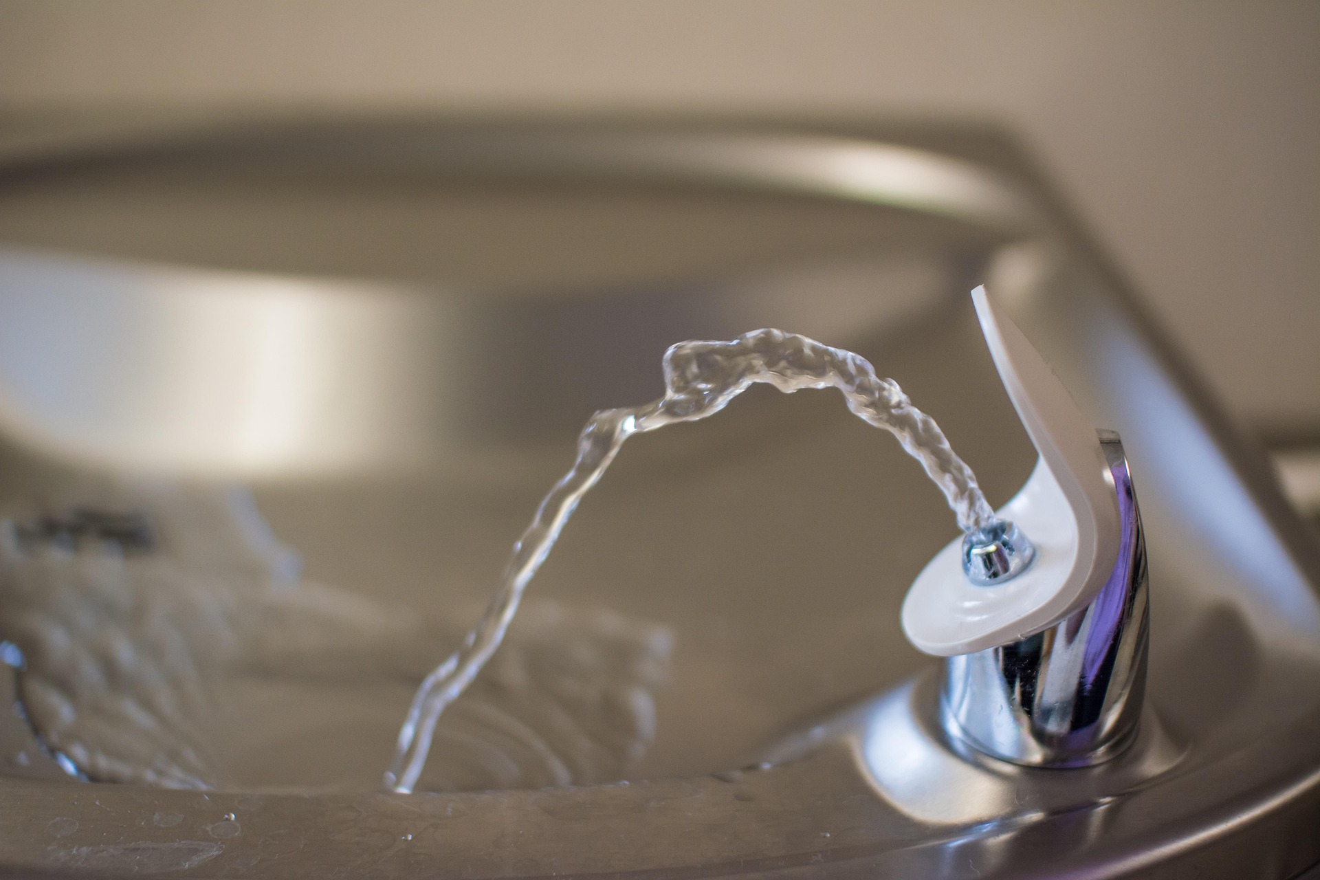 Chrome drinking fountain with running water